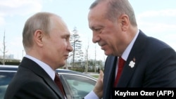 Rusiya və Türkiyə prezidentləri Vladimir Putin və Rəcəb Tayyib Ərdoğan (Arxiv fotosu)