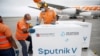 FILE PHOTO: Workers take care of the shipment of Russia's Sputnik V vaccine at the airport, in Caracas